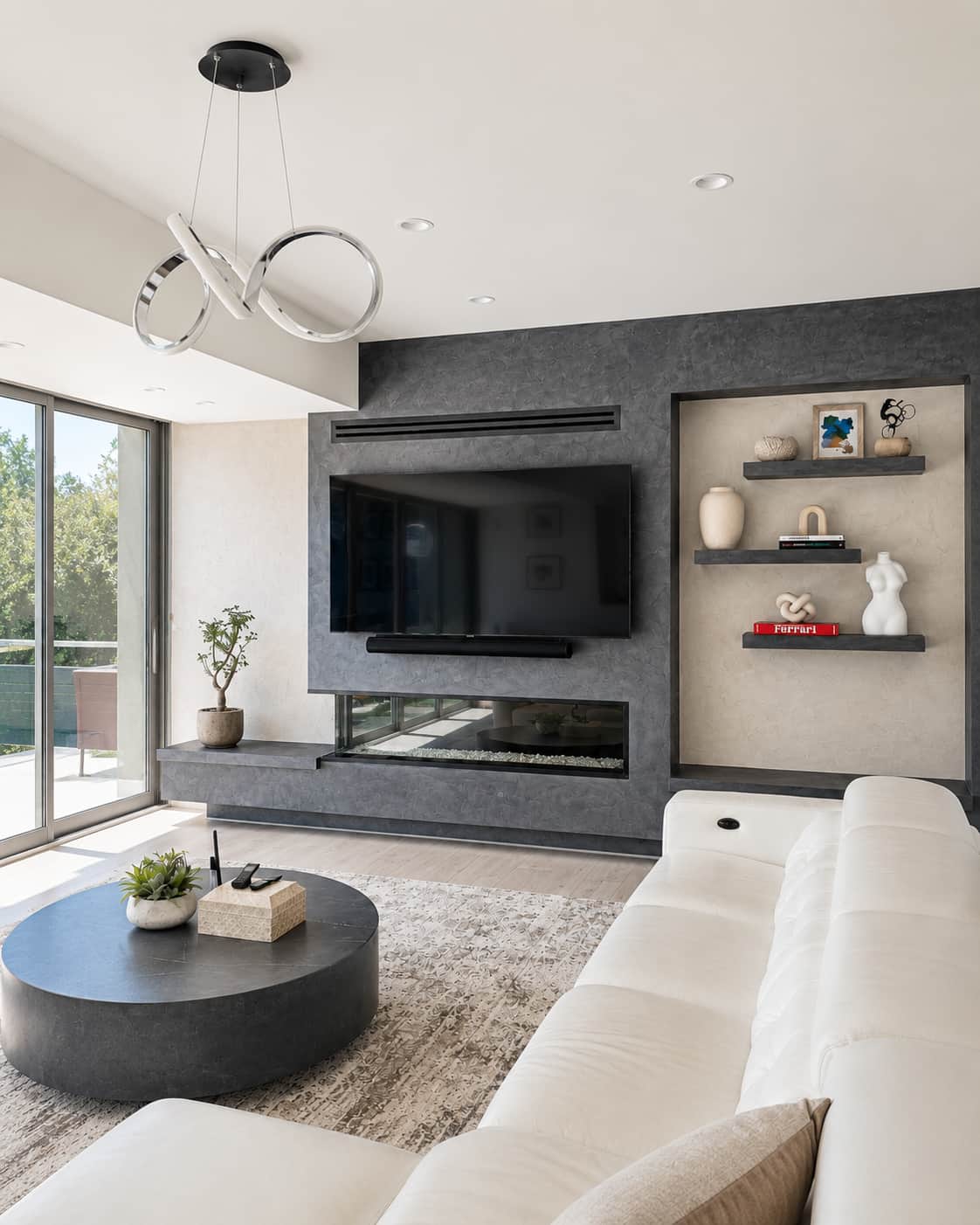 Metallic Cadoro plaster feature wall in charcoal framing a media unit and fireplace.